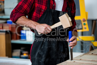 Carpenter working on his craft