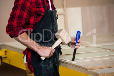 Carpenter working on his craft