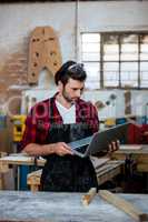 Carpenter working on his computer