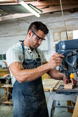 Carpenter using a drill