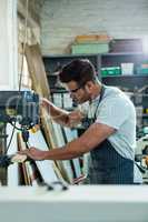 Carpenter using a drill