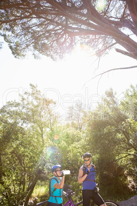 Senior couple standing with their bikes