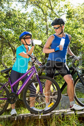 Senior couple standing with their bikes