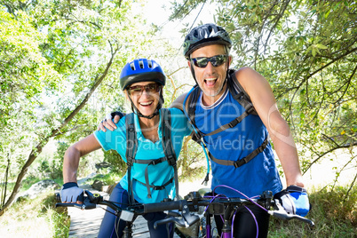 Senior couple standing with their bikes