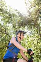 Senior man is on his bike in a forest