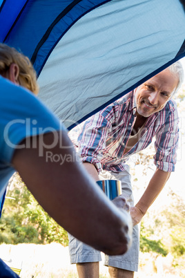 senior couple inside a tent