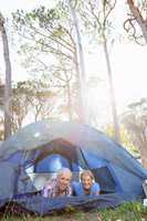 senior couple elongating inside their tent