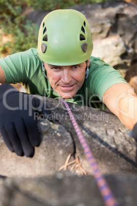 Close up man rock climbing