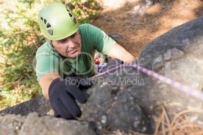 Close up man rock climbing