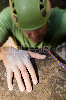 Close up man rock climbing