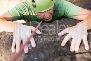 Close up man rock climbing
