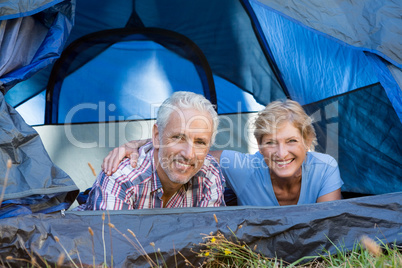 Mature couple smiling and laying