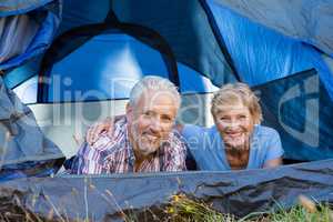 Mature couple smiling and laying