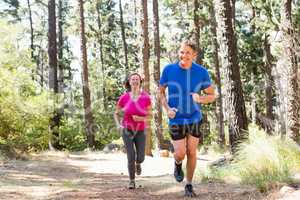 Couple smiling and running