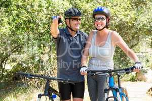 Couple smiling with their bike