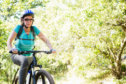 Mature woman riding bike