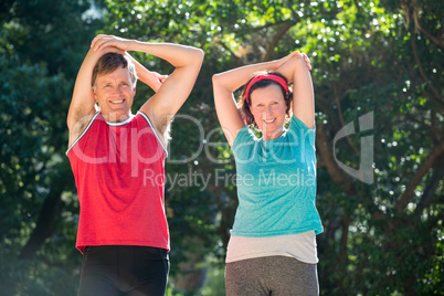 Couple stretching their arms