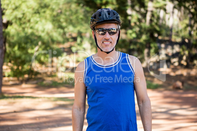 Mature bike rider man posing