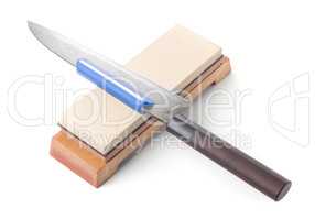Trditional japanese kitchen knife and water stone. Isolated on w