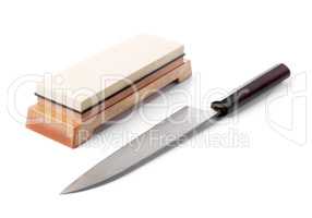 Trditional japanese kitchen knife and water stone. Isolated on w