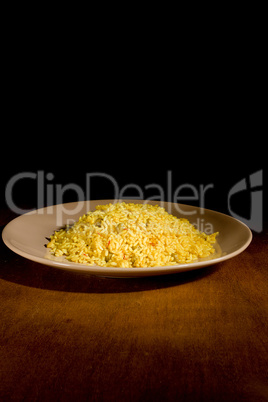 Risotto with Saffron on wooden table