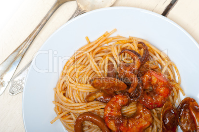 Italian seafood spaghetti pasta on red tomato sauce