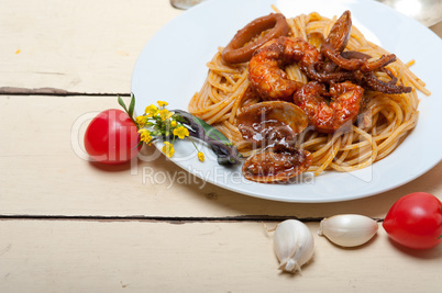 Italian seafood spaghetti pasta on red tomato sauce