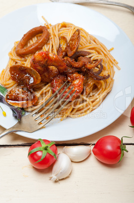 Italian seafood spaghetti pasta on red tomato sauce