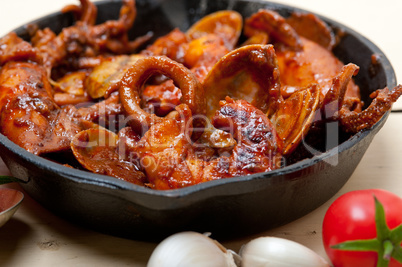 fresh seafoos stew on an iron skillet