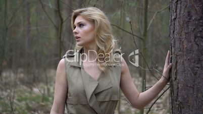 blonde woman in the forest
