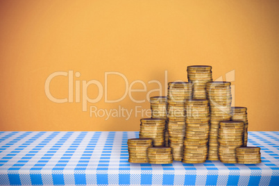 Composite image of stack of gold coins