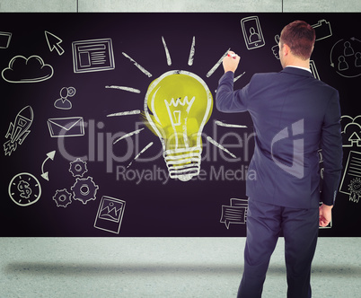 Composite image of business man writing with chalk