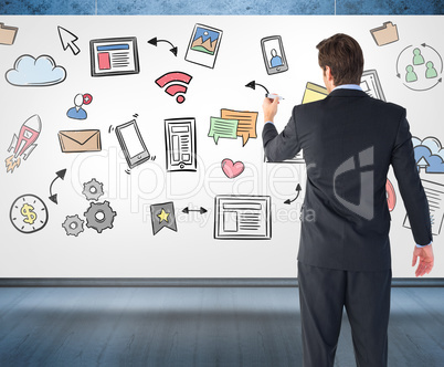 Composite image of businessman standing back to camera writing w