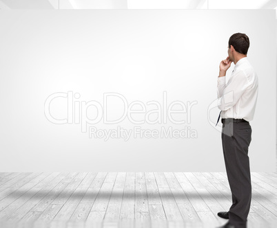 Composite image of thoughtful classy businessman looking away