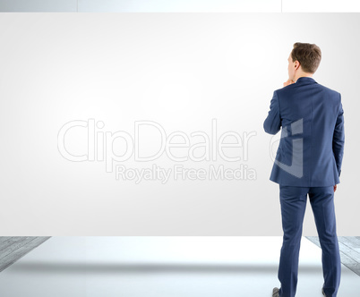 Composite image of wear view of businessman thinking