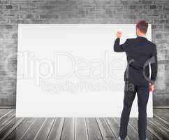 Composite image of business man writing with chalk