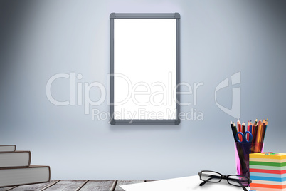 Composite image of school supplies on desk