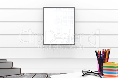 Composite image of school supplies on desk