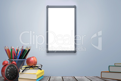 Composite image of school supplies on desk