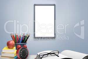 Composite image of school supplies on desk