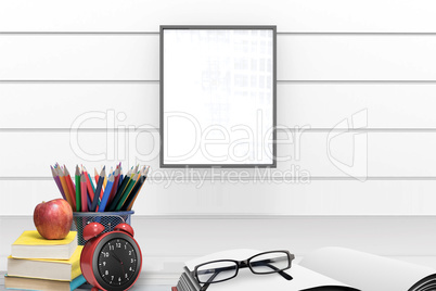 Composite image of school supplies on desk