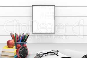 Composite image of school supplies on desk