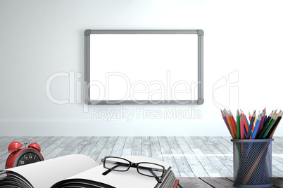 Composite image of school supplies on desk