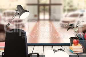 Composite image of a desk with lamp and documents