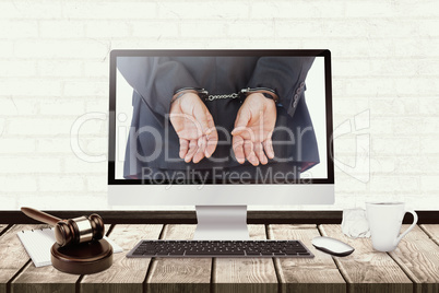 Composite image of closeup of handcuffed businessman