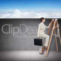 Composite image of businessman looking on a ladder