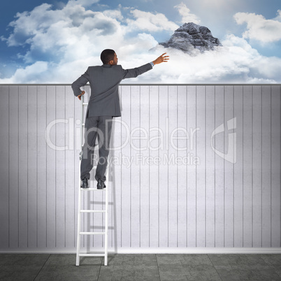 Composite image of businessman looking on a ladder