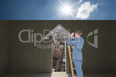 Composite image of businessman looking on a ladder