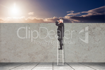 Composite image of mature businessman standing on ladder