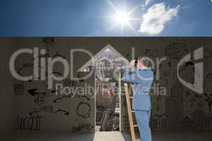 Composite image of businessman looking on a ladder